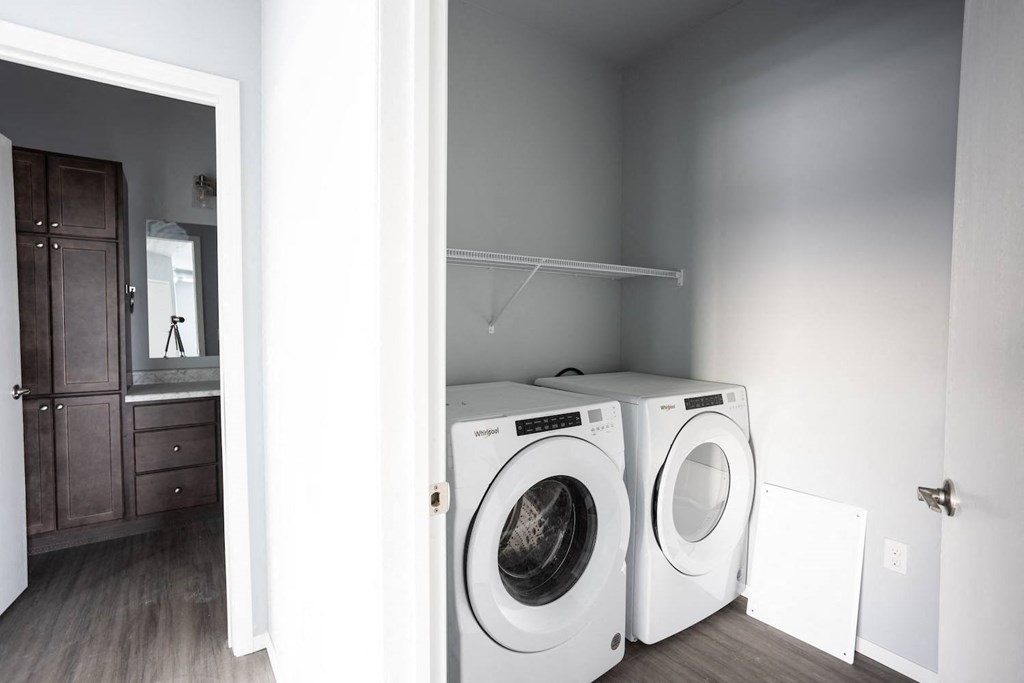 a white washer and dryer in a laundry room