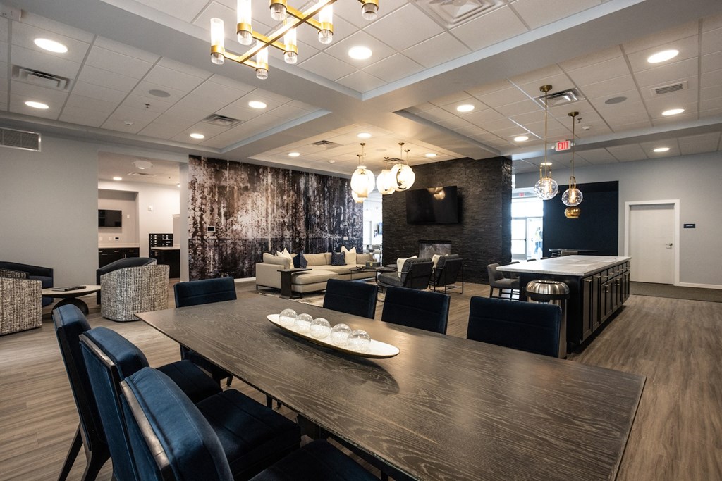 a dining room and living room with a table and chairs