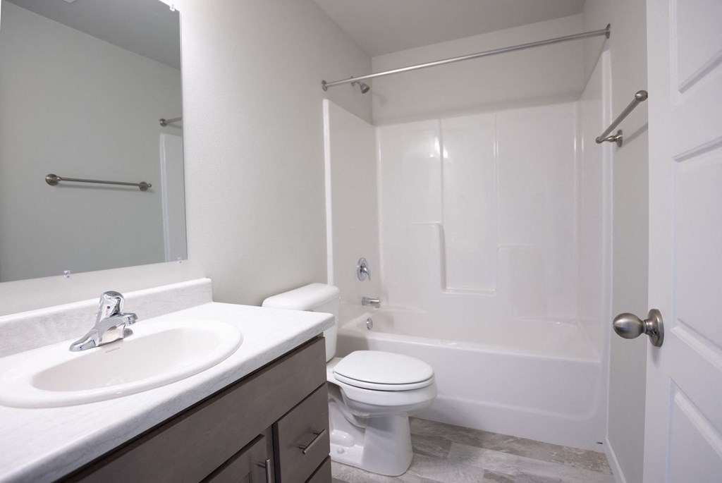 a bathroom with a sink toilet and a shower