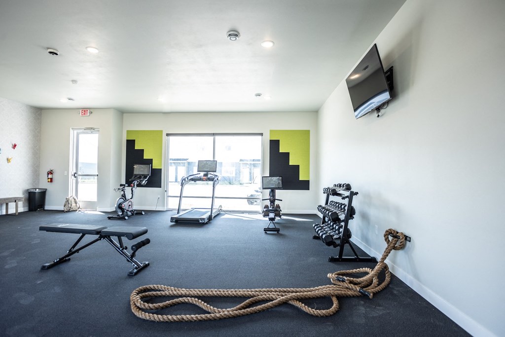 the gym at the district flats apartments in lenexa