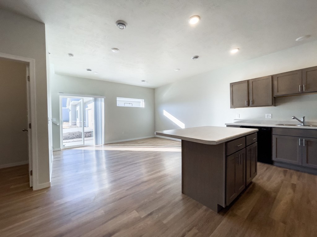 an empty kitchen and living room in a new home