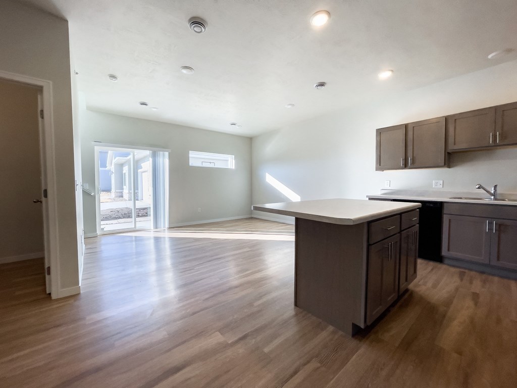 an empty kitchen and living room in a new home