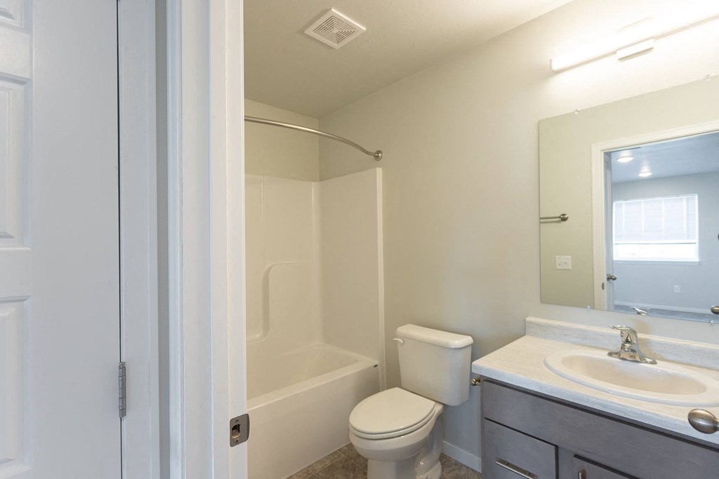 a bathroom with a sink toilet and a shower