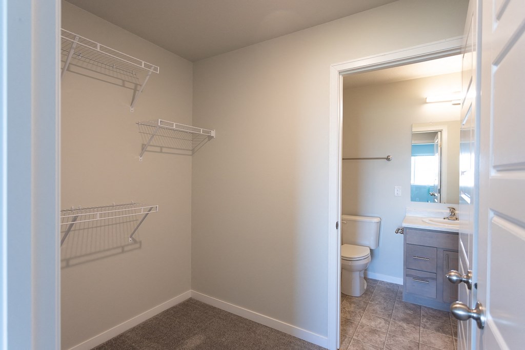 a bathroom with a toilet and a shower and a sink