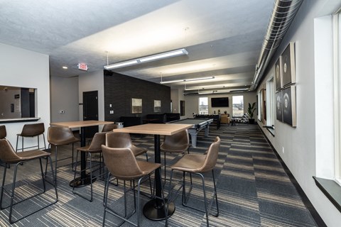 A conference room with a long table and chairs.