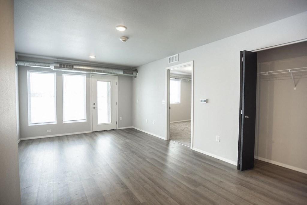 Spacious living room with neutral walls and ample natural light.