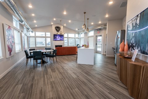 a dining room and living room with a table and chairs
