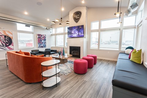 a living room with couches and chairs and a fireplace