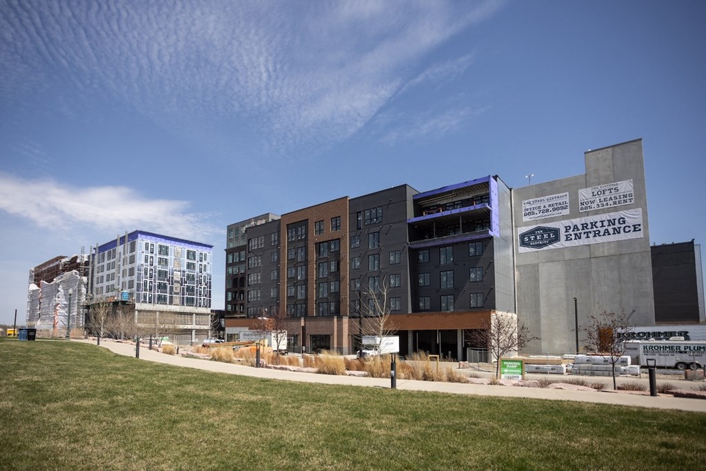 a group of new buildings on a city street