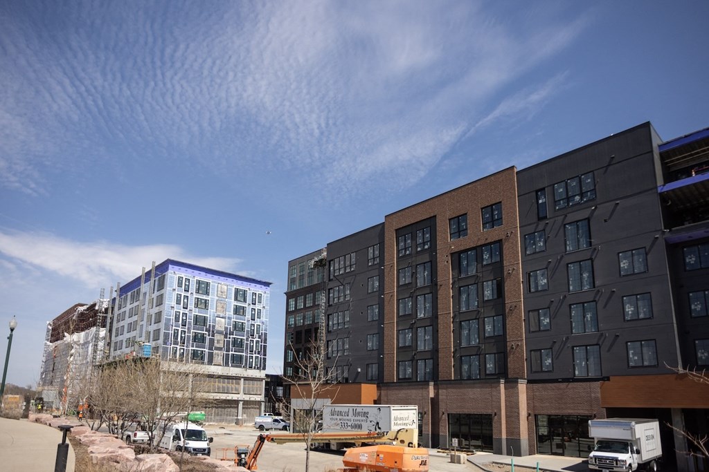 a group of buildings under construction on a city street