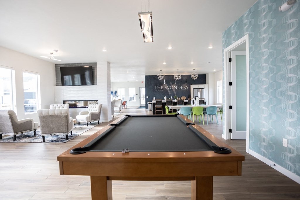 play a game of pool in the clubhouse at the preserve at polk apartments