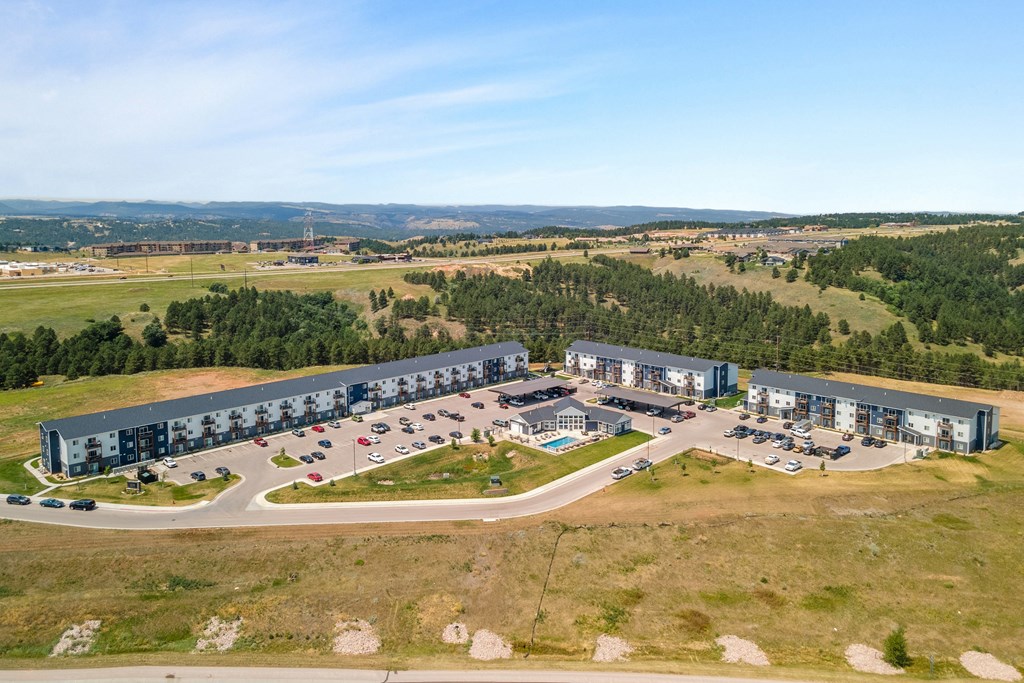 an aerial view of an office building and parking lot