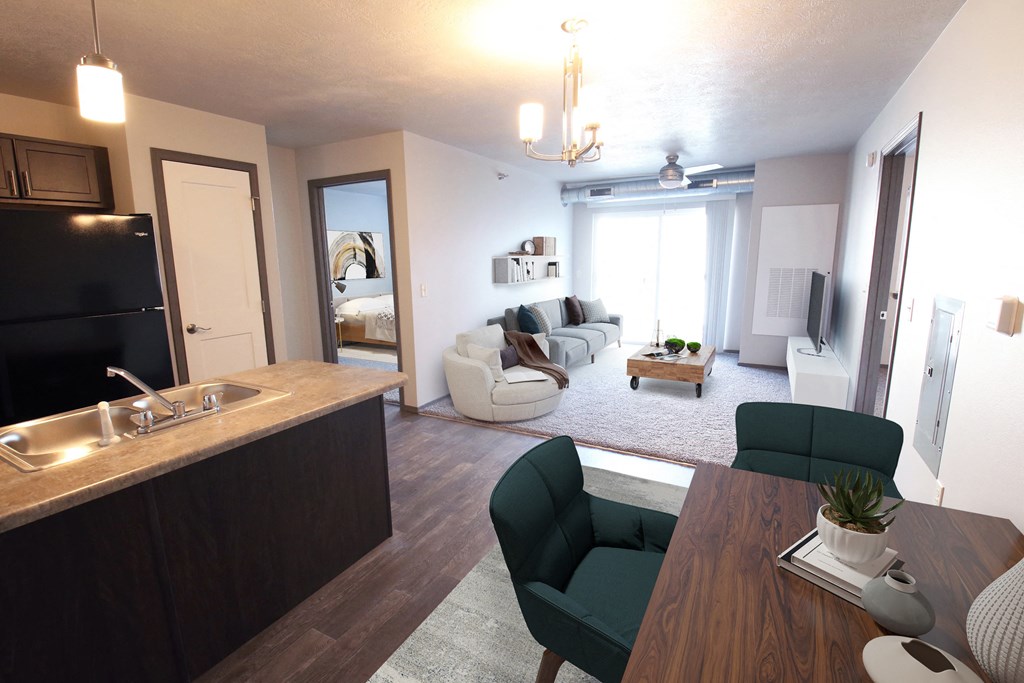 the view of a living room from the kitchen of a apartment