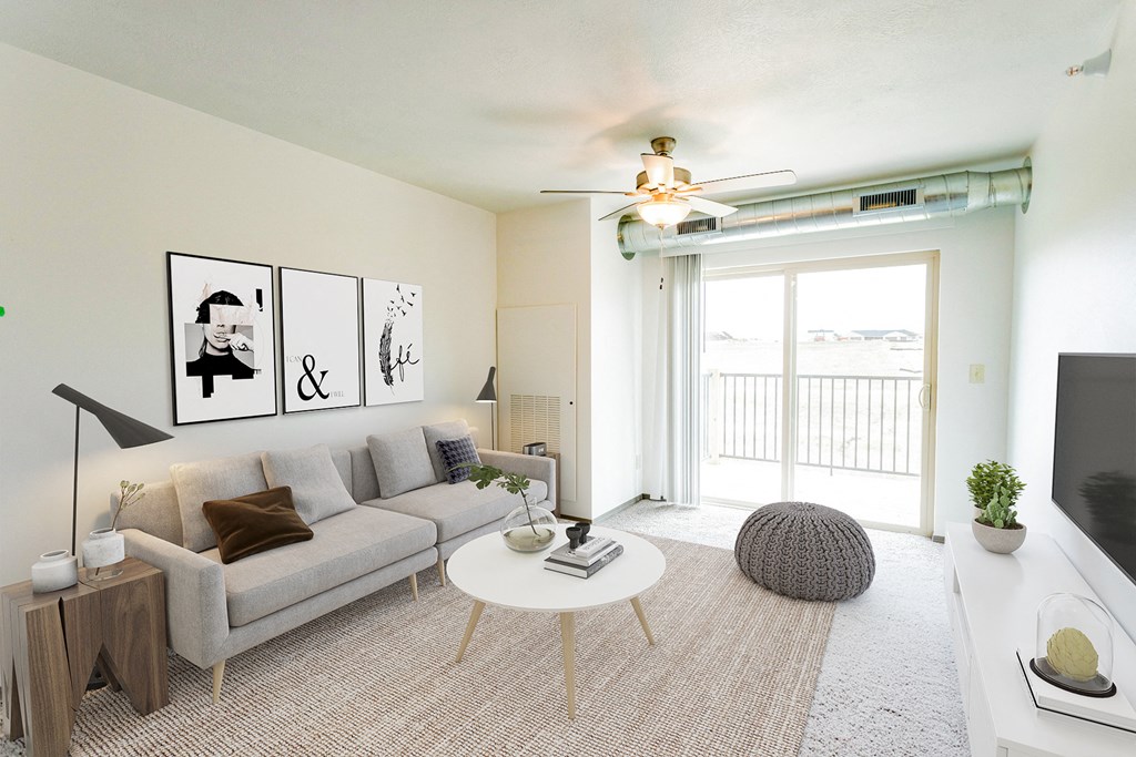 a living room with a white couch and a white coffee table