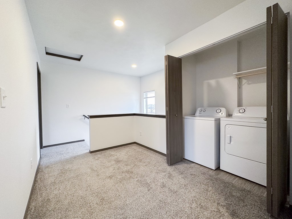 A laundry room with a washer and dryer.
