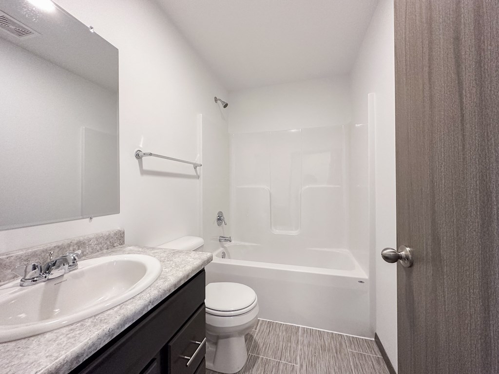 the preserve at ballantyne commons bathroom with sink toilet and shower