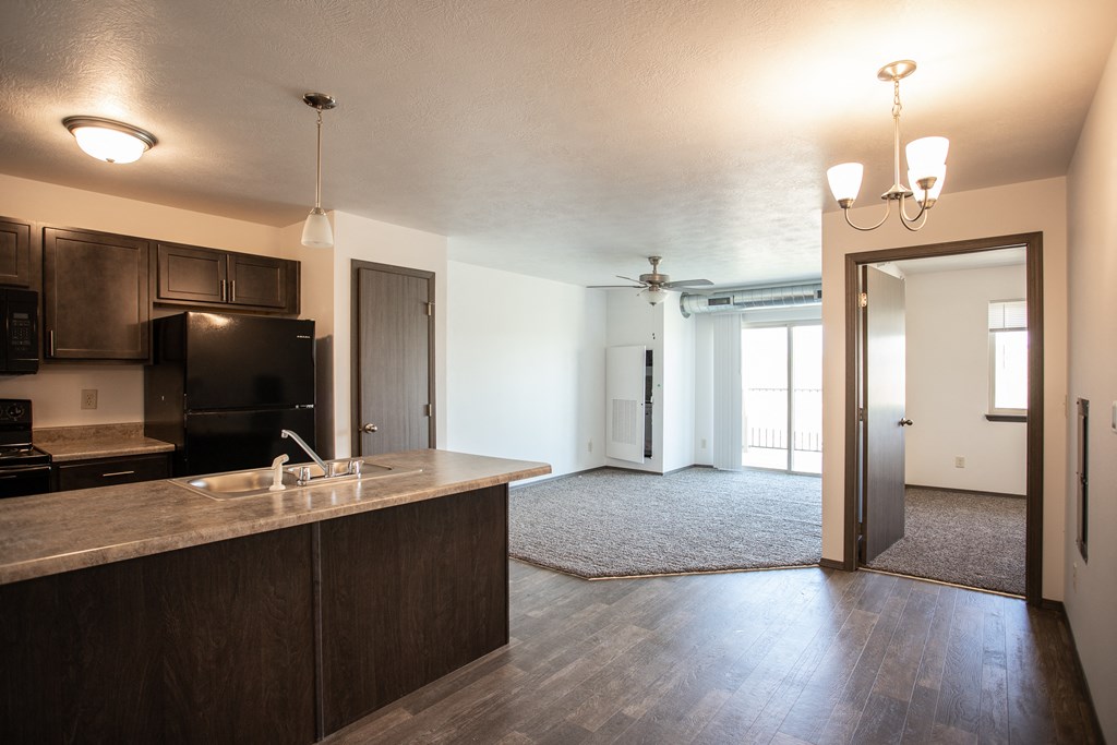 an empty kitchen and living room in an apartment