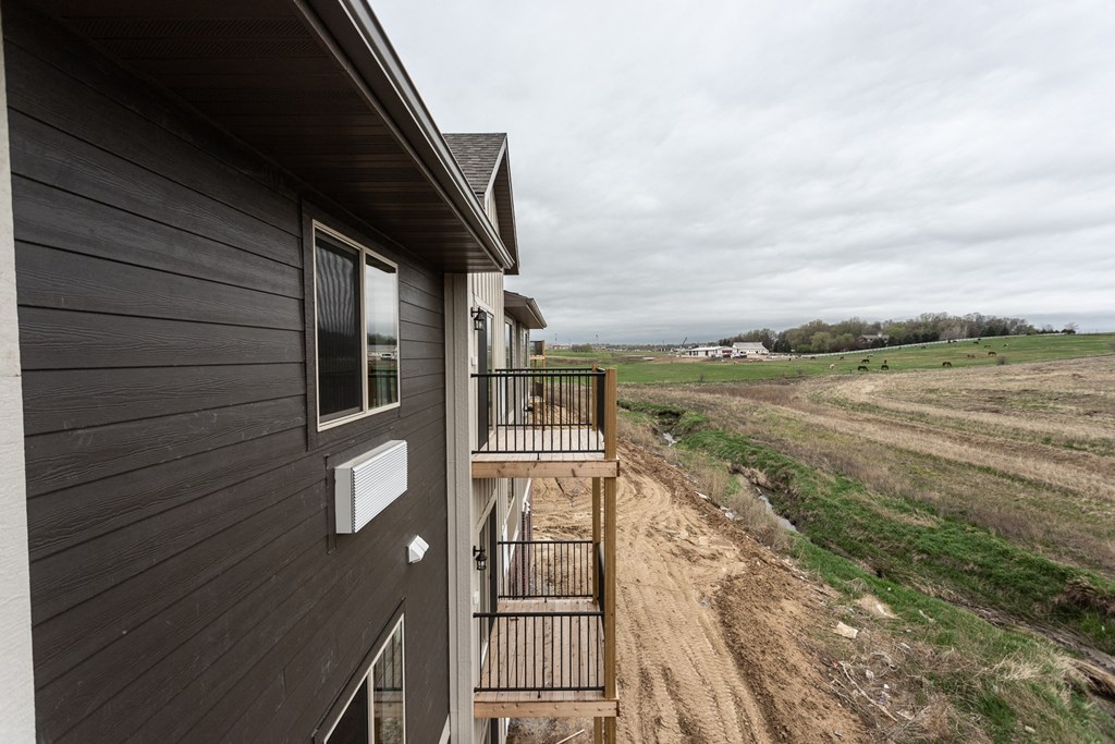 the view from the back of the home looking out into the field
