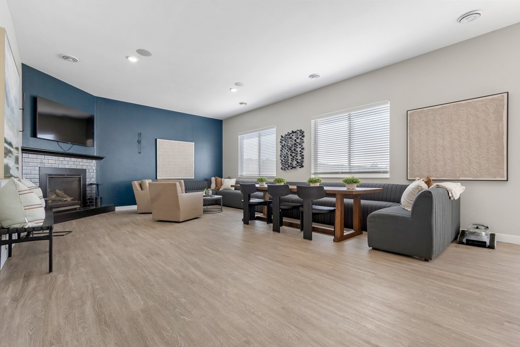 A living room with a fireplace and a television.