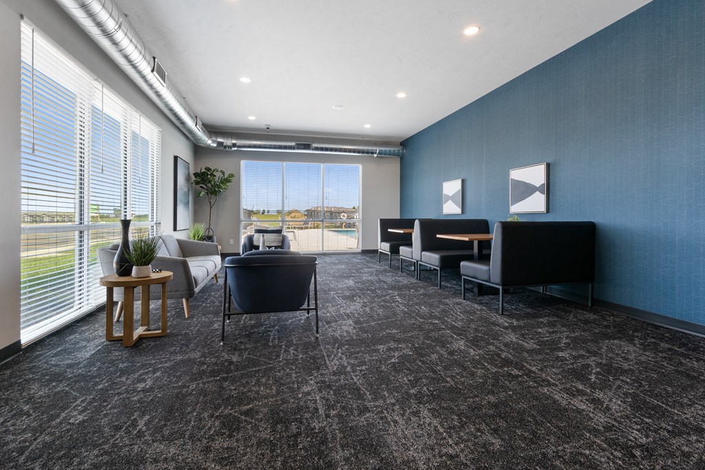 A room with grey carpet and blue walls.
