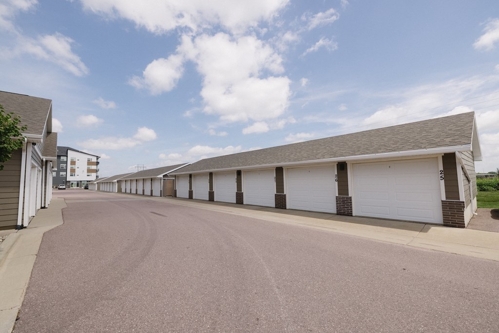 A long row of garage doors are closed.