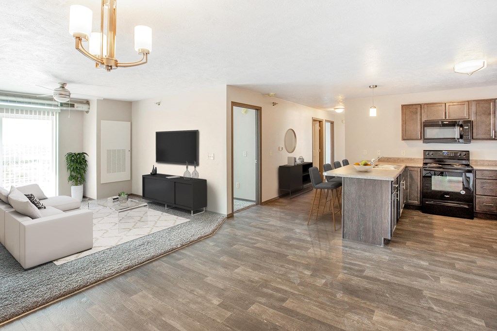 a living room with a kitchen and a dining room