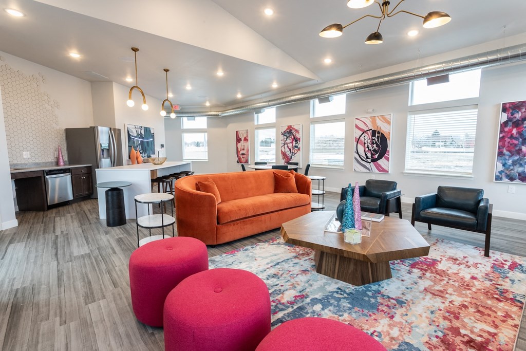 a living room with couches and chairs and a table