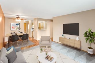 a living room with a couch and a table and a tv