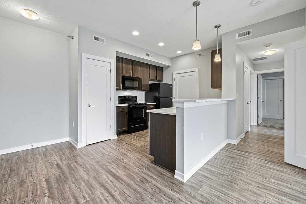 a renovated kitchen and living room in a new home