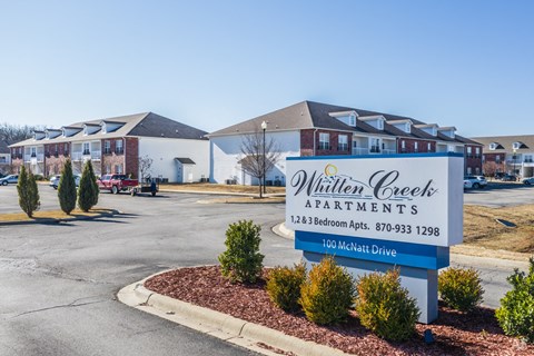 the estates apartments entrance sign