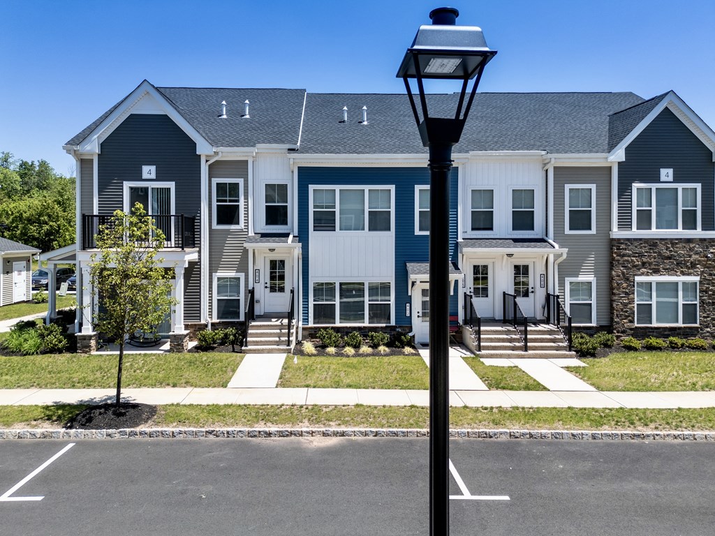 an apartment building with a street light in front of it