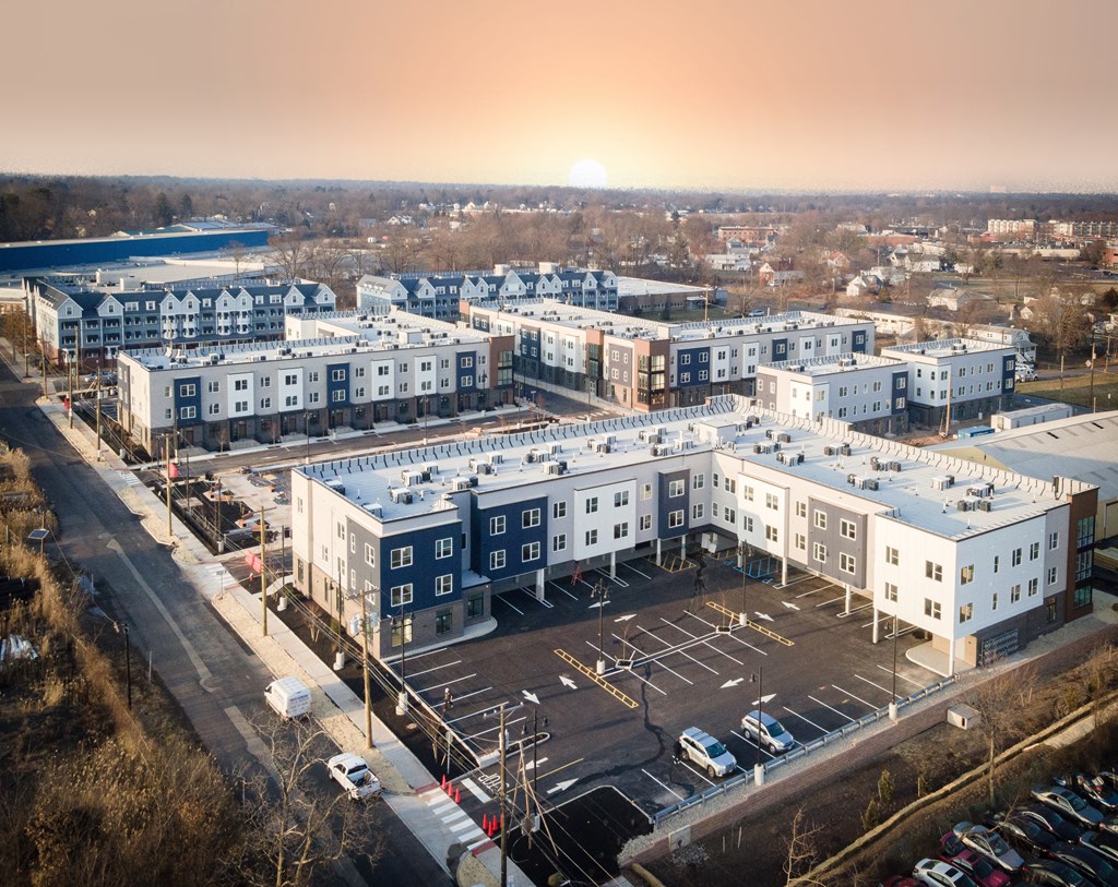 arial view of a city with buildings and parking lot