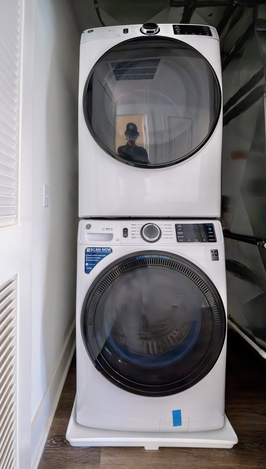 a washing machine and a dryer in a small room