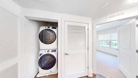 a laundry room with a washer and dryer in a closet