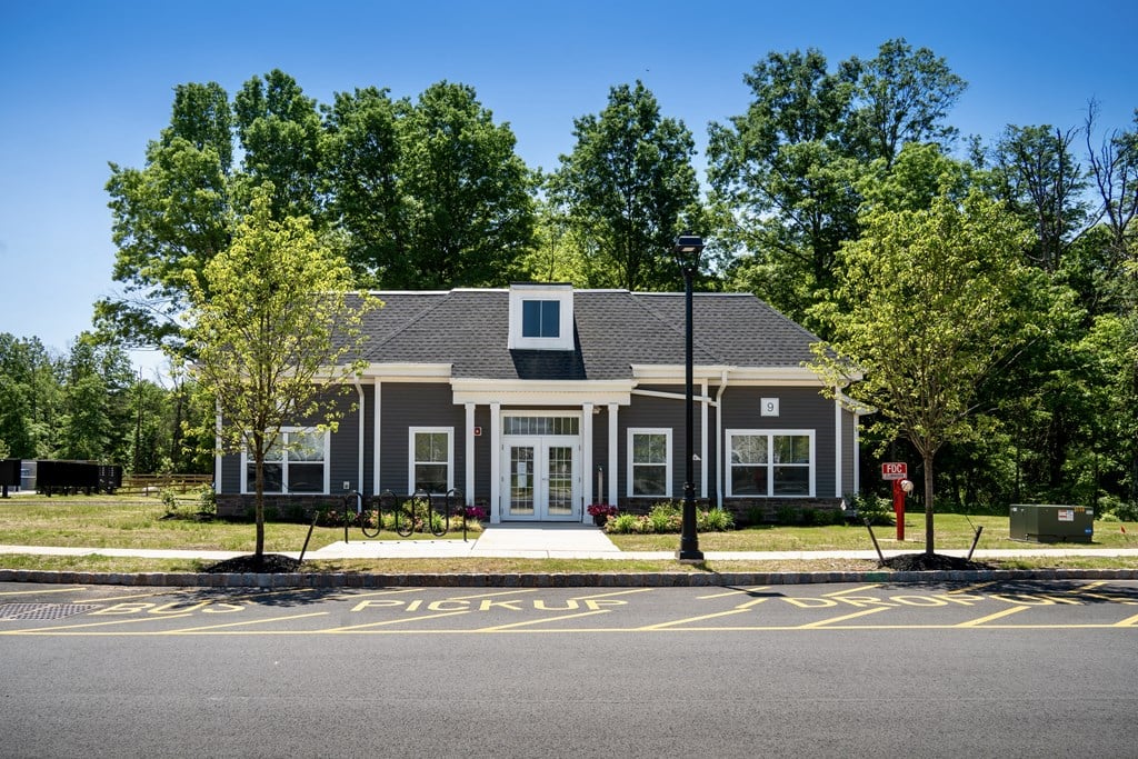 a house with a parking lot in front of it