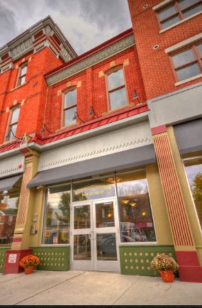 a store front of a red brick building