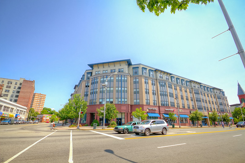 a large building on the corner of a city street