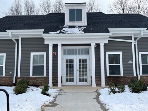 a house with snow in front of it