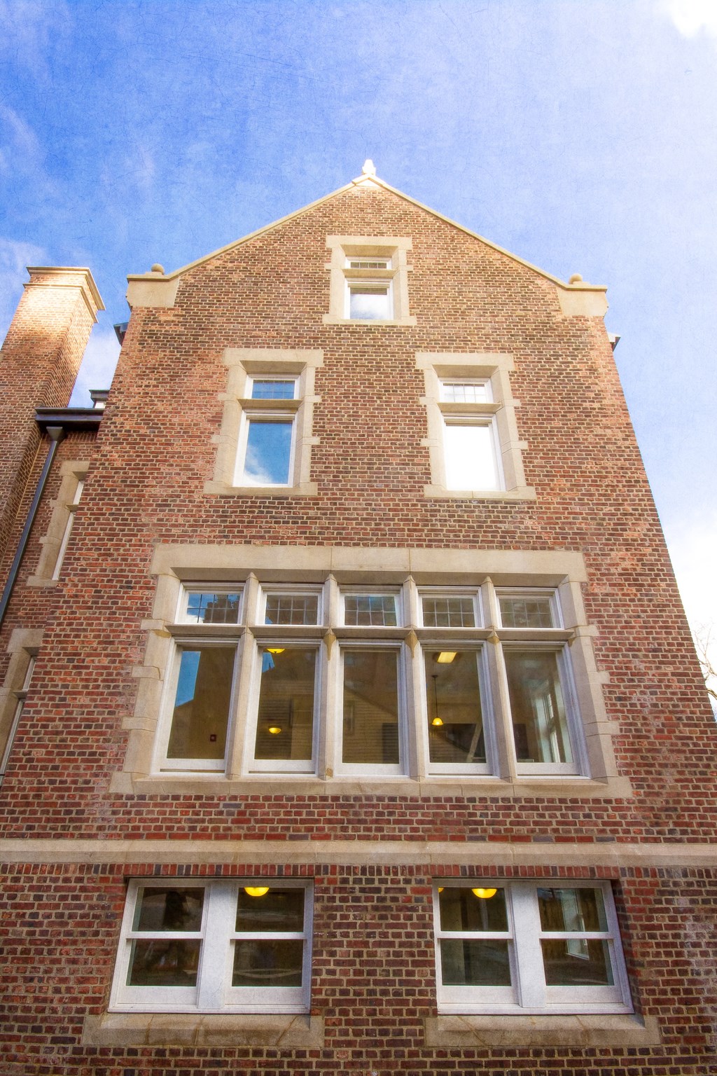 the front of a brick building with windows