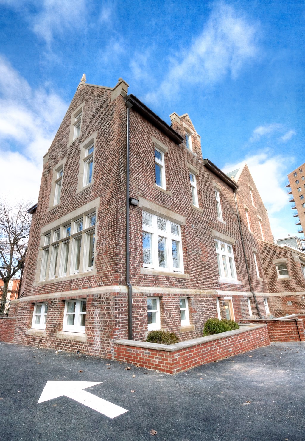 a red brick building with a blue sky in the background