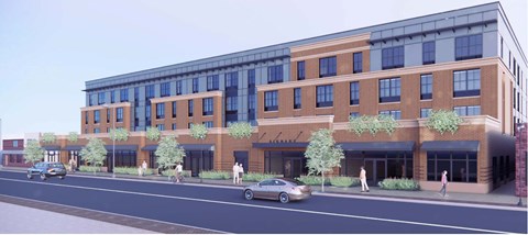 A modern building with a glass facade and a brick exterior is depicted in the image.