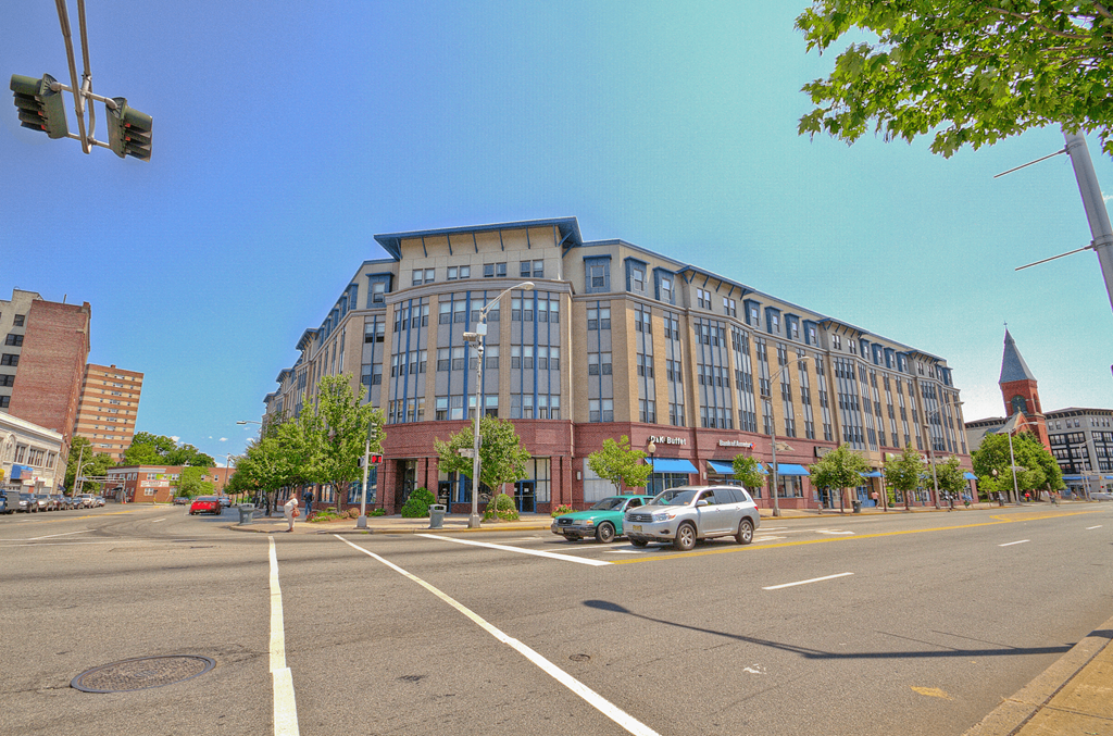 a large building on the corner of a city street