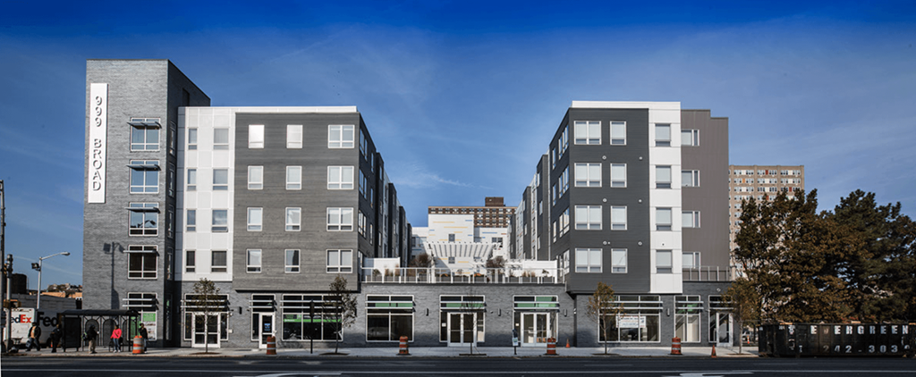 a rendering of an apartment building on a city street