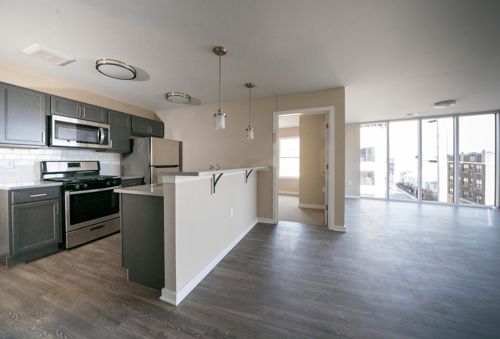 an empty kitchen and living room in an apartment