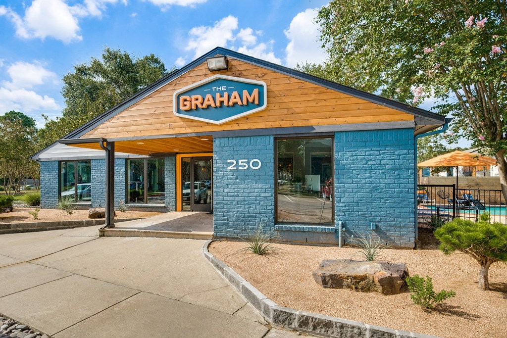 the restaurant exterior with blue brick building and wood roof