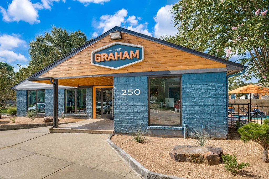 thebranham restaurant exterior with blue brick building and wood roof