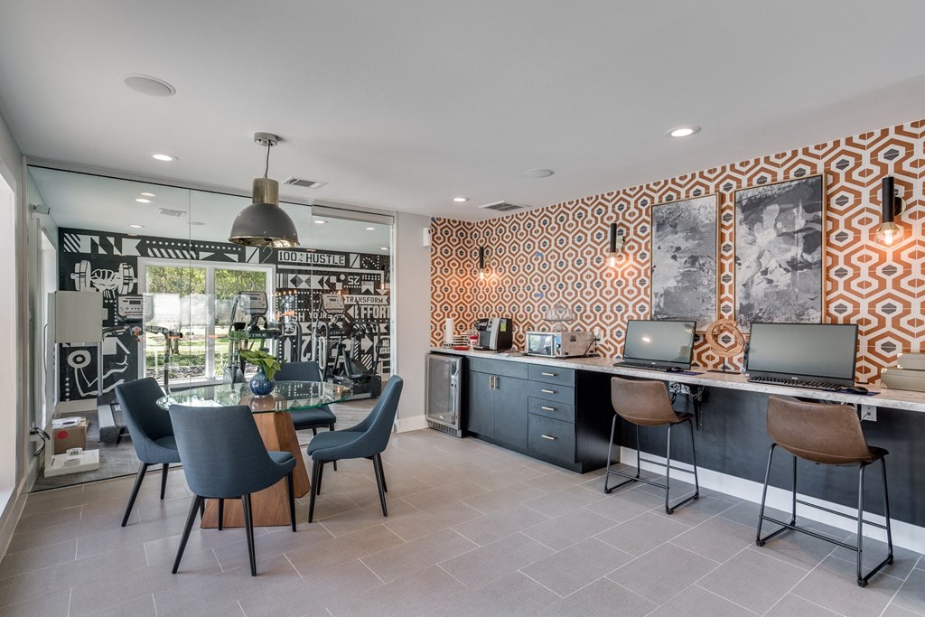 an open kitchen and dining area with a table and chairs