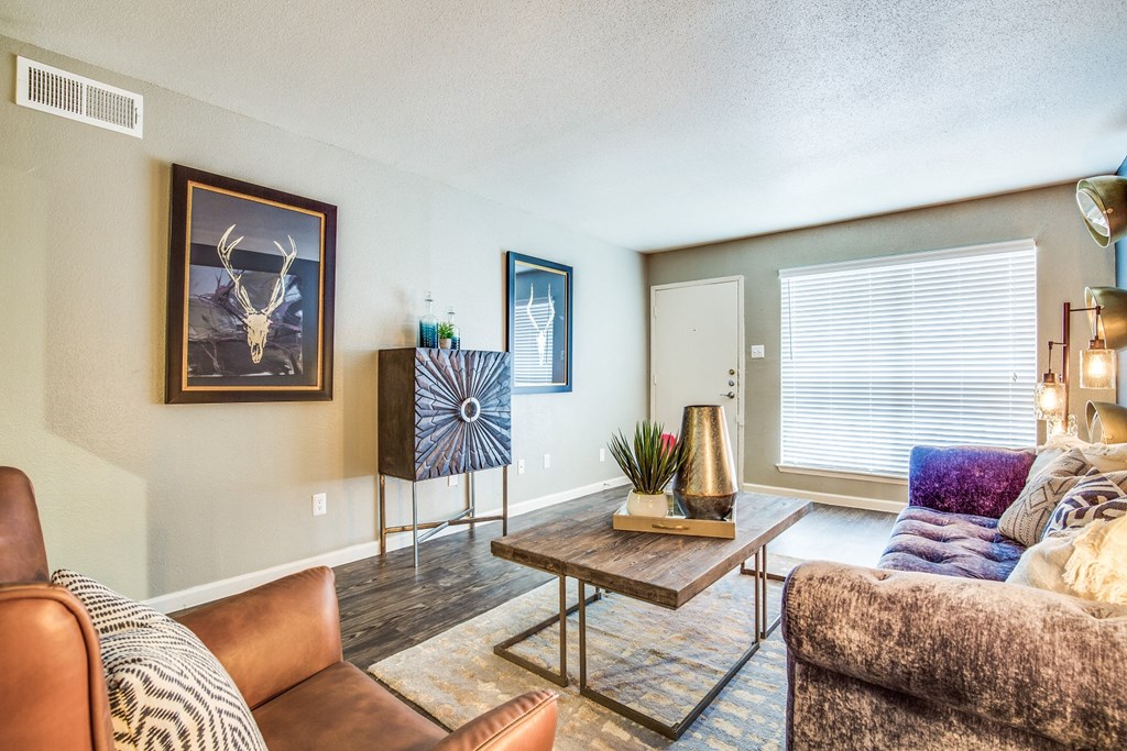 a living room with a couch and a table