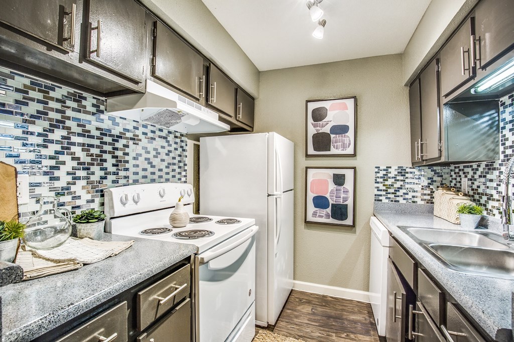 the reserve at city center spacious kitchen with white appliances