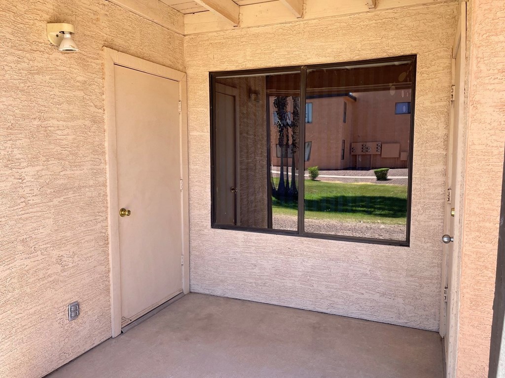 an empty room with a large window